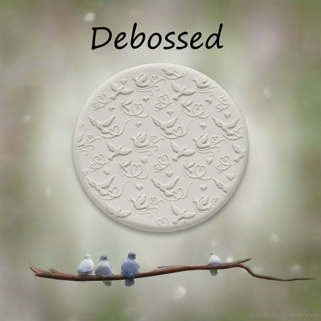 A pattern embossed in clay using a patterned debossed texture mat.