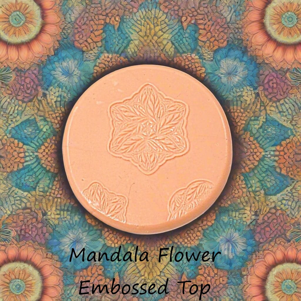 flower mandala debossed in silly putty Using a embossed texture mat. This will give you an idea of what it will look like on metal clay or polymer clay.