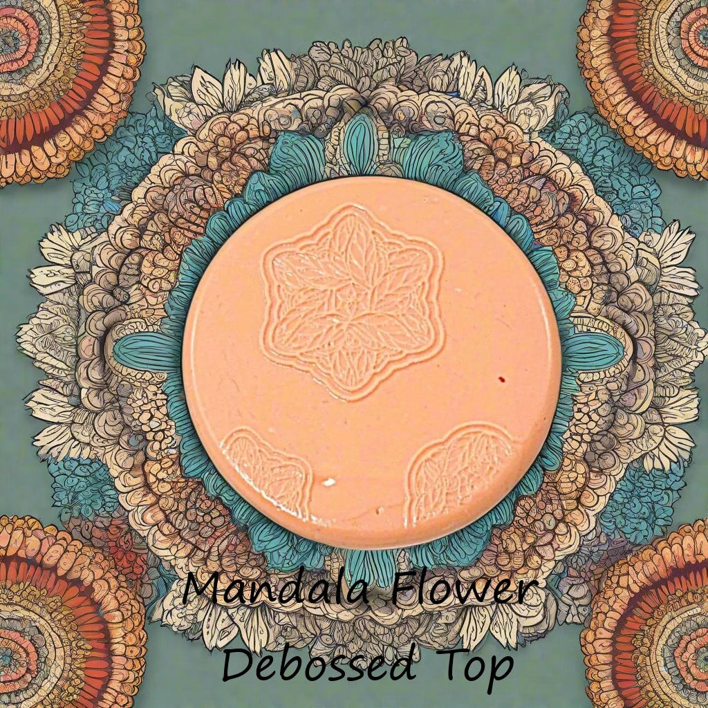 flower mandala embossed in silly putty Using a debossed texture mat. This will give you an idea of what it will look like on metal clay or polymer clay.