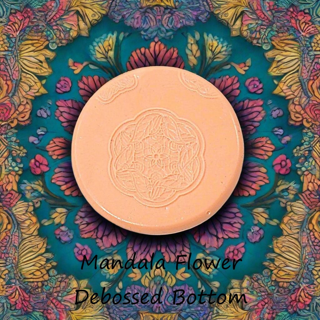 flower mandala embossed in silly putty Using a debossed texture mat. This will give you an idea of what it will look like on metal clay or polymer clay.