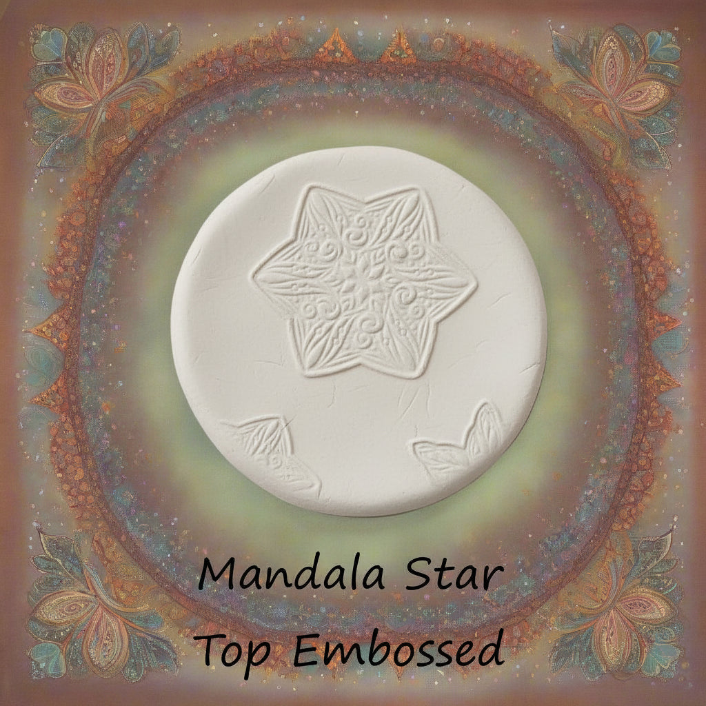A star flower mandala debossed in clay Using a embossed texture mat. 