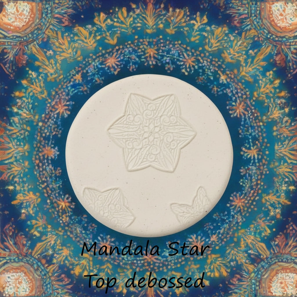 A star flower mandala embossed in clay Using a debossed texture mat. 