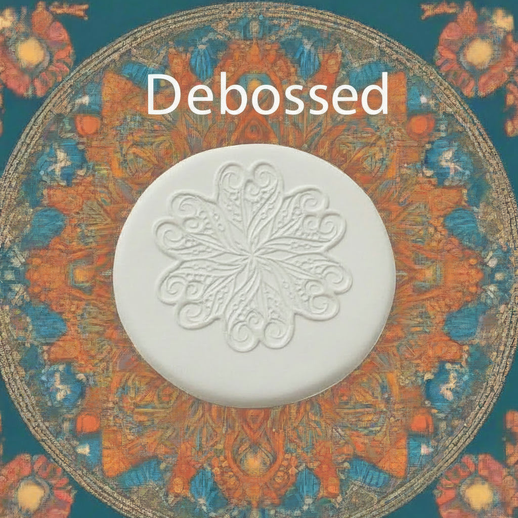 A flower mandala embossed in clay Using a debossed texture mat. 