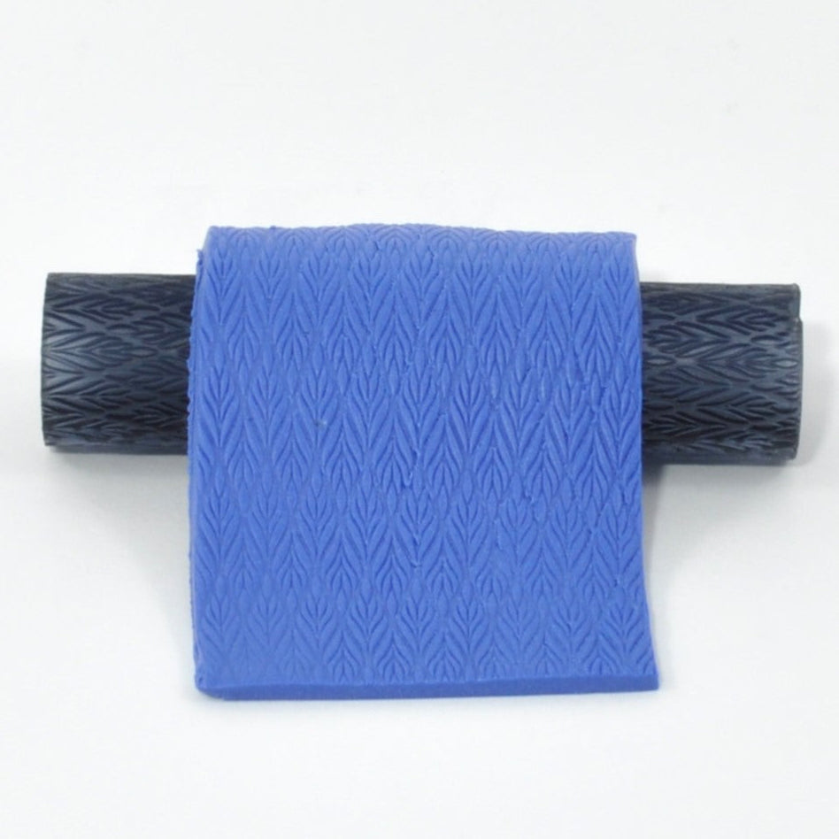 Blue roller with  textured leaves on a white background