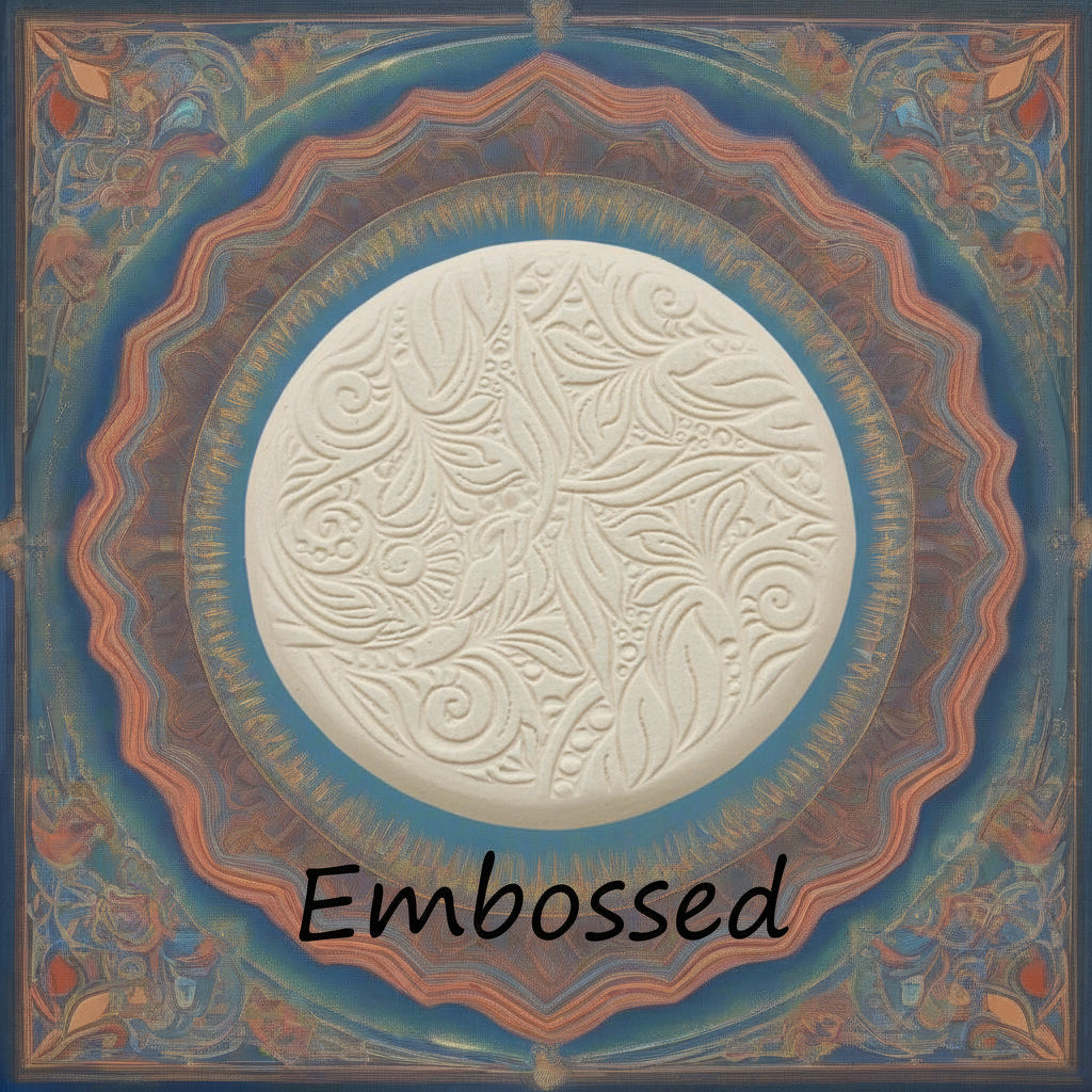 A flowery design debossed in clay using an embossed texture mat. This will give you an idea of what it will look like on metal clay or polymer clay.