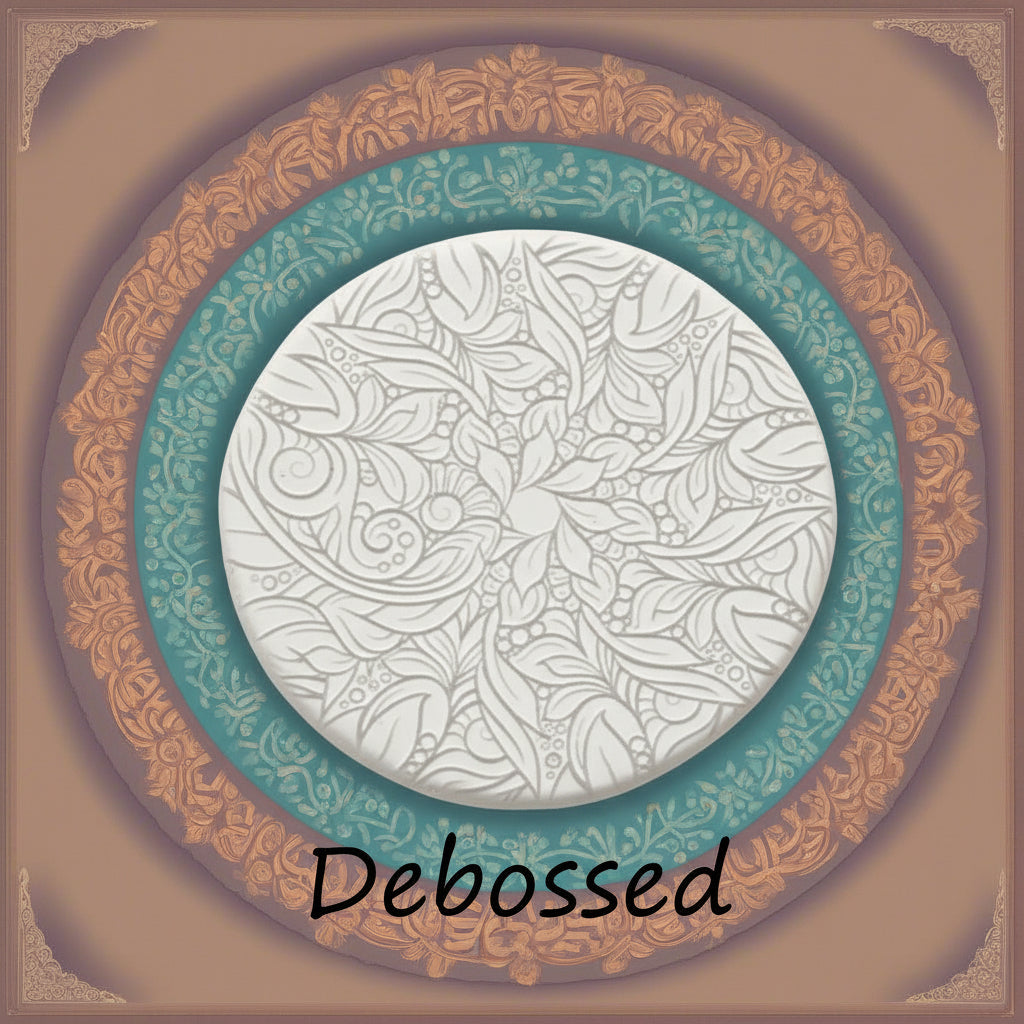 A flowery design embossed in clay using a  debossed texture mat. This will give you an idea of what it will look like on metal clay or polymer clay.
