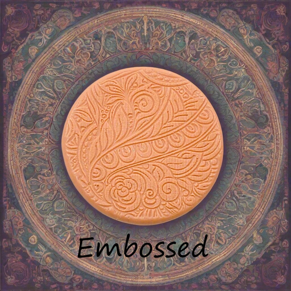 A flowery design debossed in silly putty using an embossed texture mat. This will give you an idea of what it will look like on metal clay or polymer clay.
