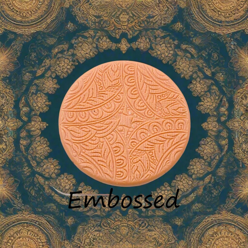 A flowery design debossed in silly putty Using a embossed texture mat. This will give you an idea of what it will look like on metal clay or polymer clay.