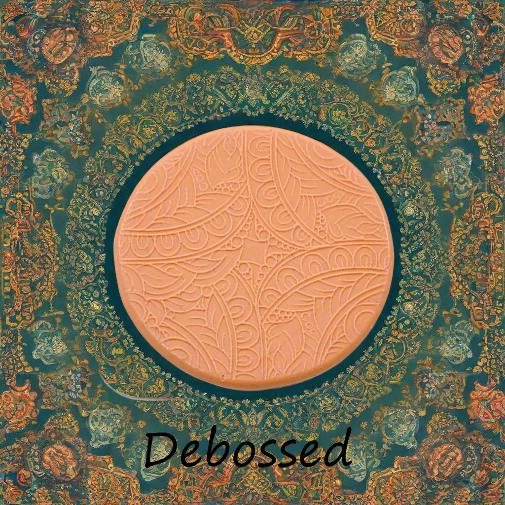 A flowery design embossed in silly putty Using a  debossed texture mat. This will give you an idea of what it will look like on metal clay or polymer clay.