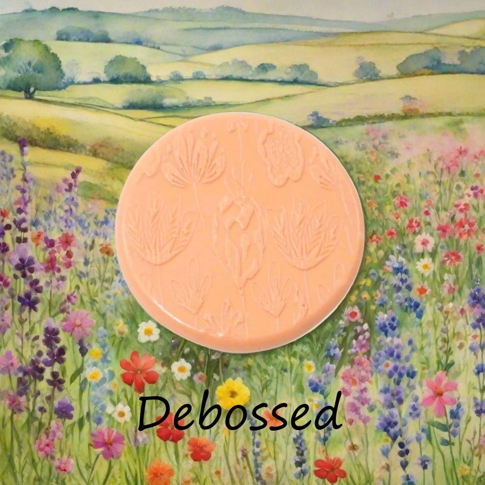 Flowers embossed in silly putty Using a  debossed texture mat. This will give you an idea of what it will look like on metal clay or polymer clay