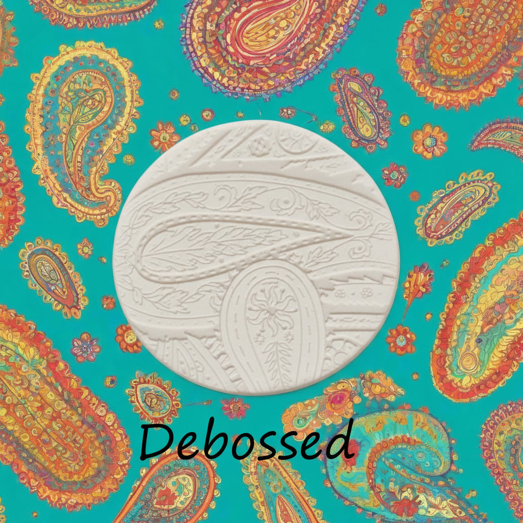 A pattern embossed in clay using a patterned debossed texture mat.