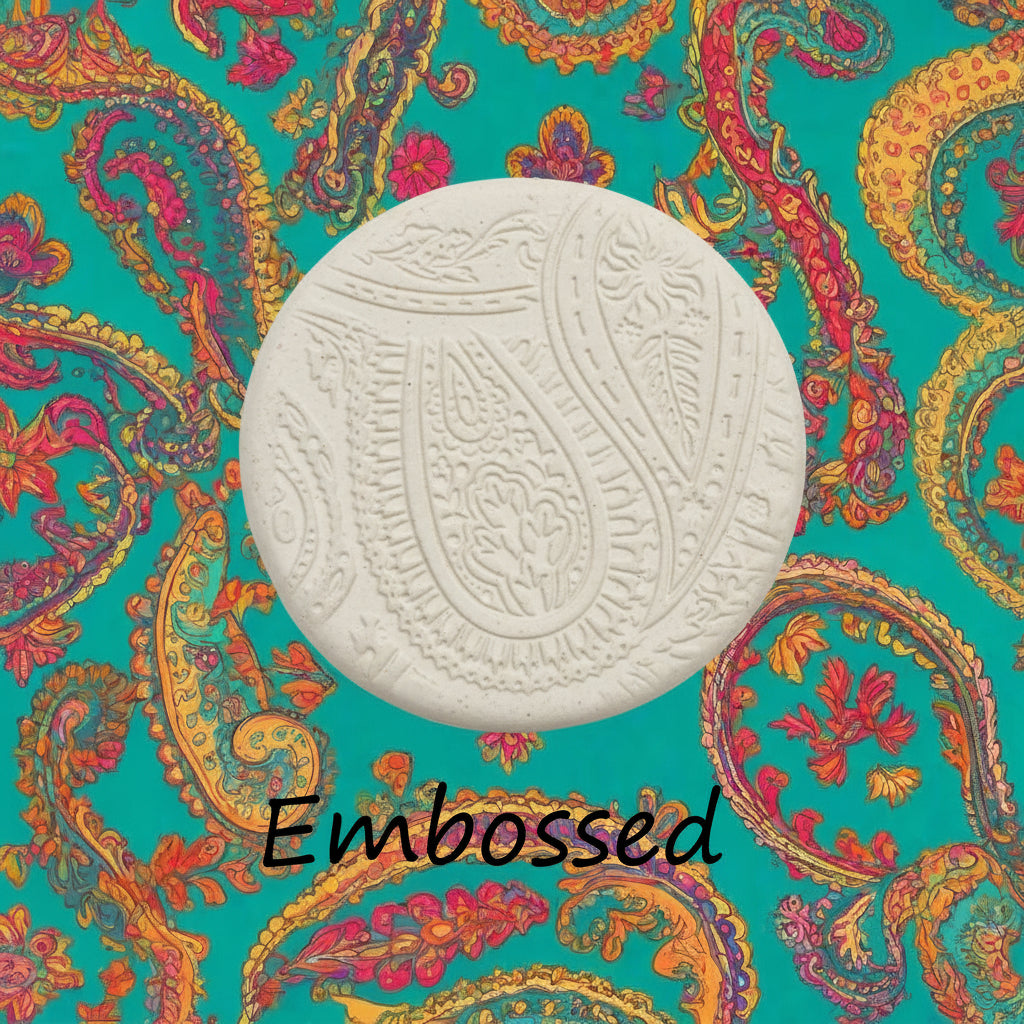 A pattern debossed in clay using a patterned embossed texture mat.