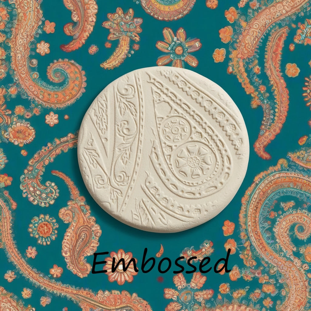 A pattern debossed in clay using a patterned embossed texture mat.