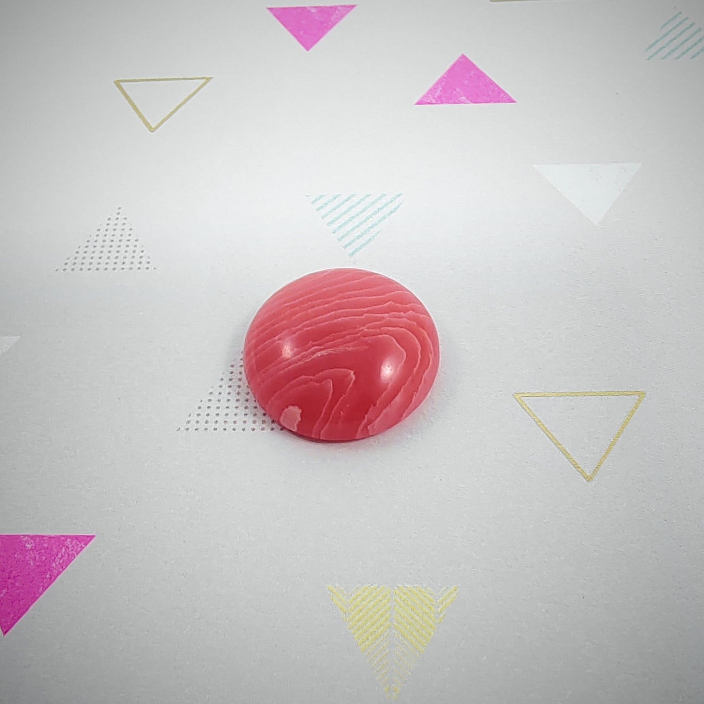 Pink marbled agate on a background with geometric shapes