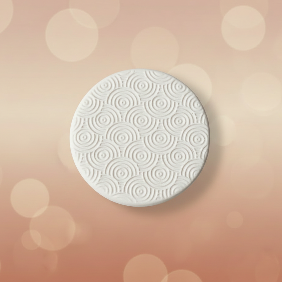 Rainbow Circles debossed in silly putty Using a  embossed texture mat. This will give you an idea of what it will look like on metal clay or polymer clay