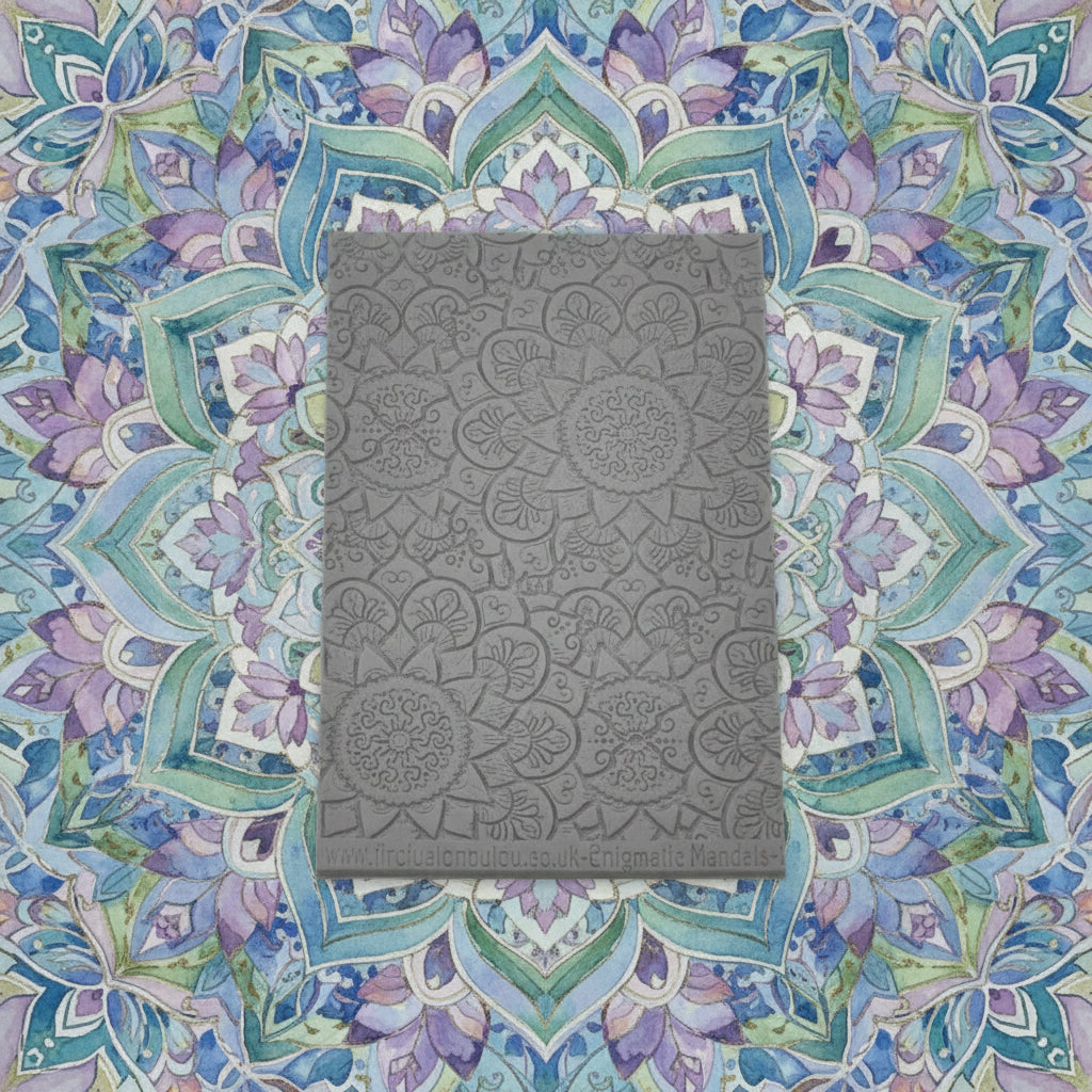 A debossed texture mat with a flowery mandala design. Use to make an impression on metal clay and polymer clay.
