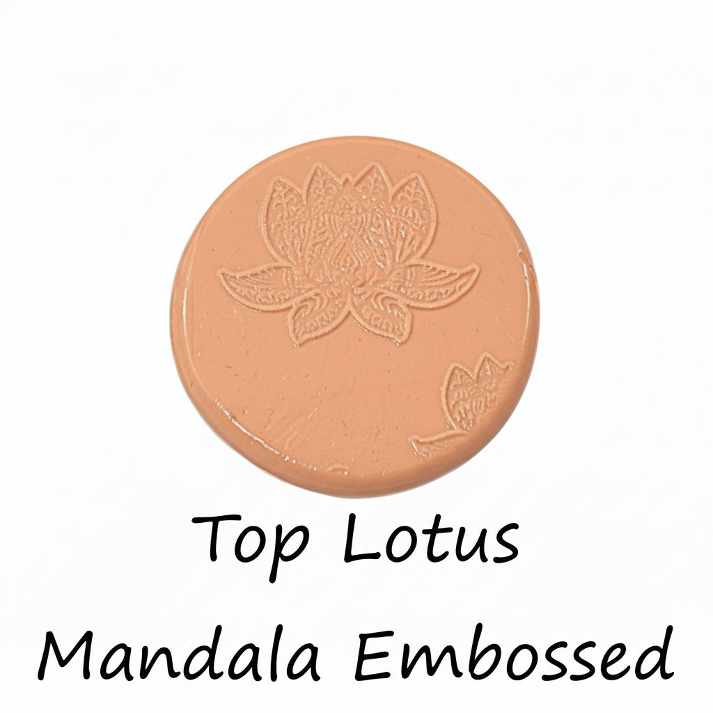 A lotus flower mandala debossed in silly putty Using a embossed texture mat in grey material. This will give you an idea of what it will look like on metal clay or polymer clay.