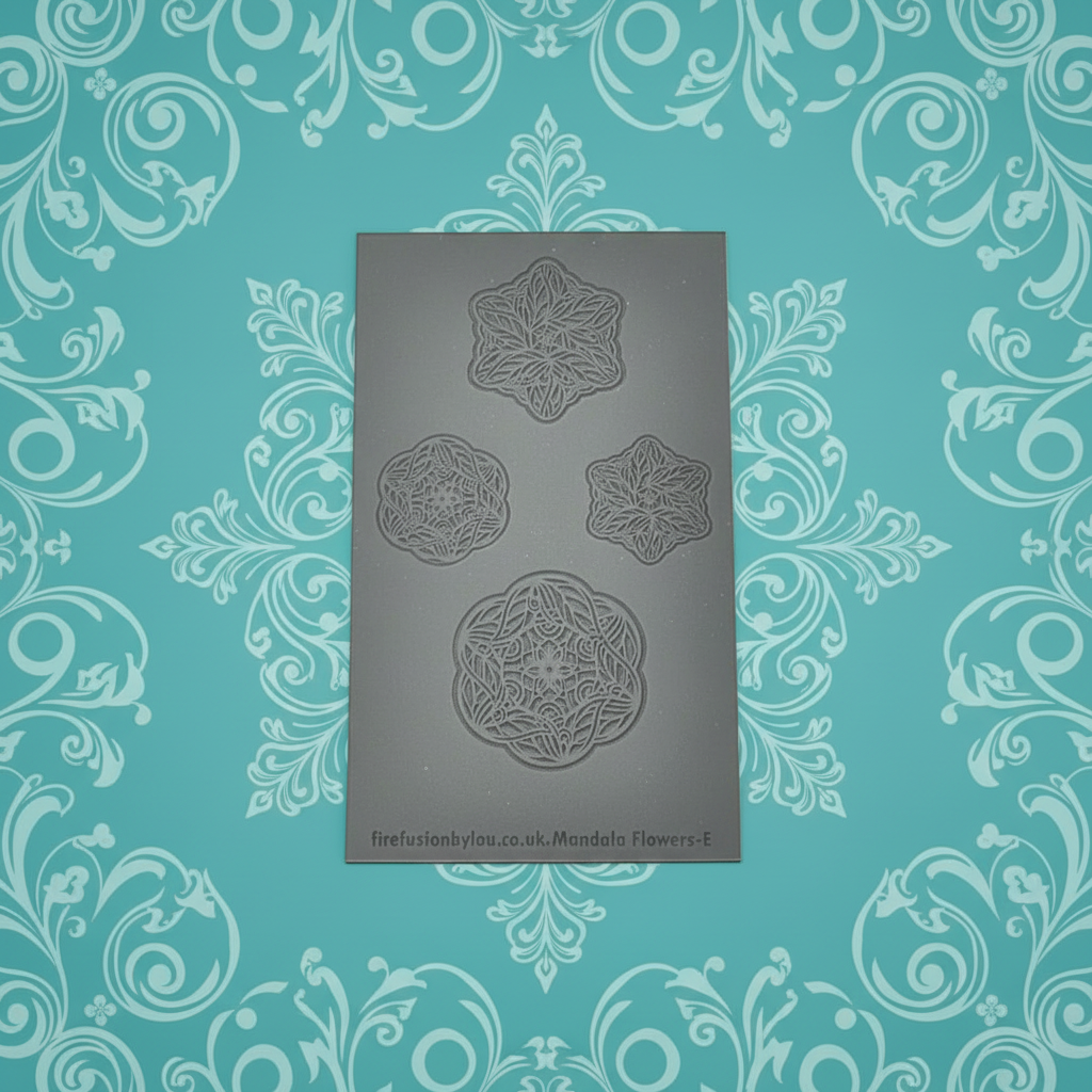 An embossed texture mat with mandala  flowers. Use to make an impression on metal clay and polymer clay.