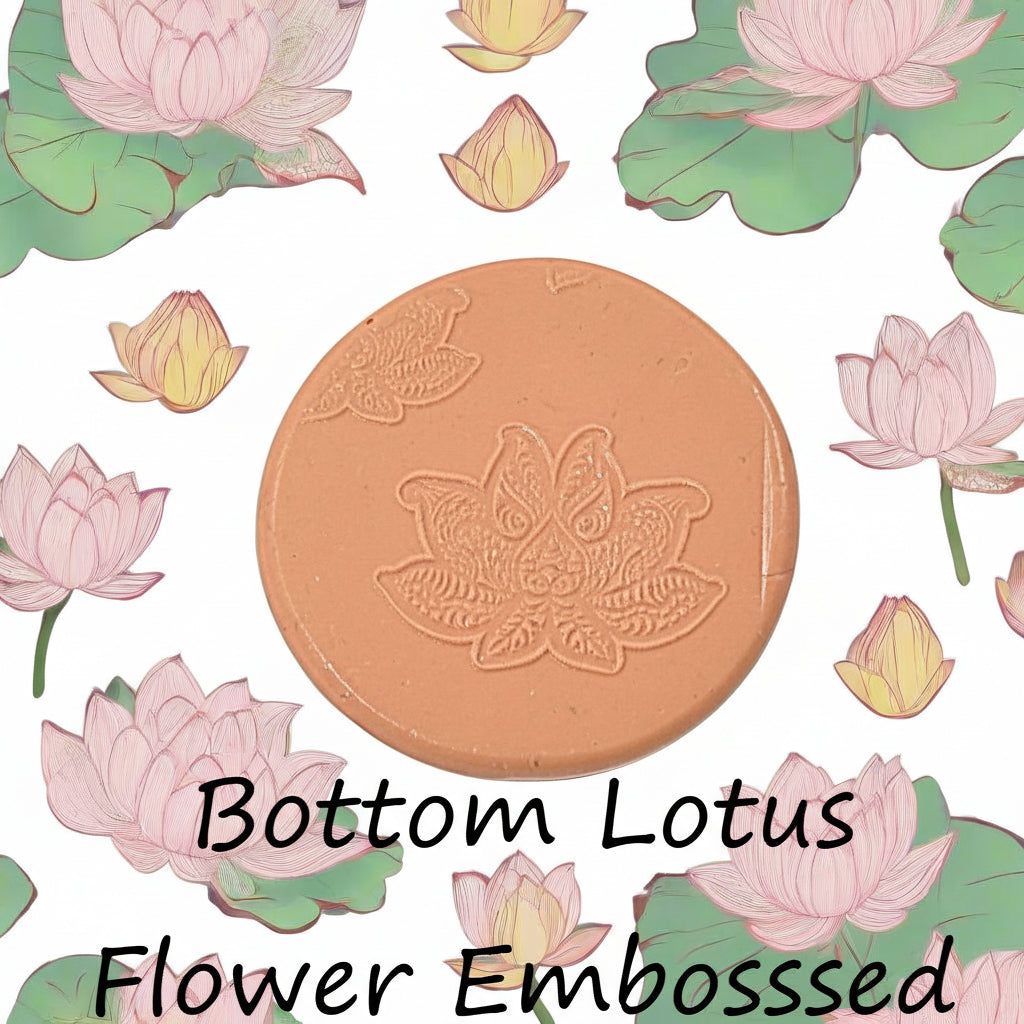 A lotus flower mandala debossed in silly putty Using a embossed texture mat in grey material. This will give you an idea of what it will look like on metal clay or polymer clay.
