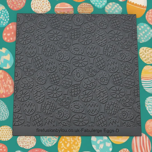 A repeating pattern debossed texture mat in grey material. This texture mat will give you an embossed effect on metal clay or polymer clay.