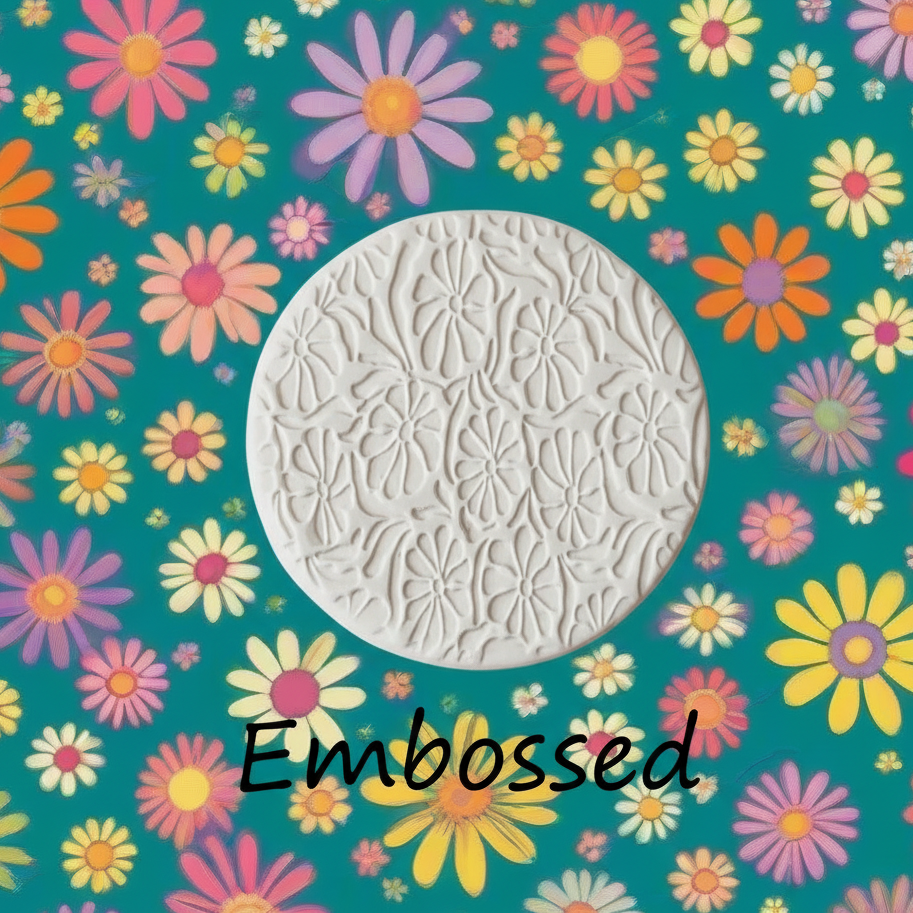 Retro flowers debossed in clay using a embossed texture mat. This will give you an idea of what it will look like on metal clay or polymer clay
