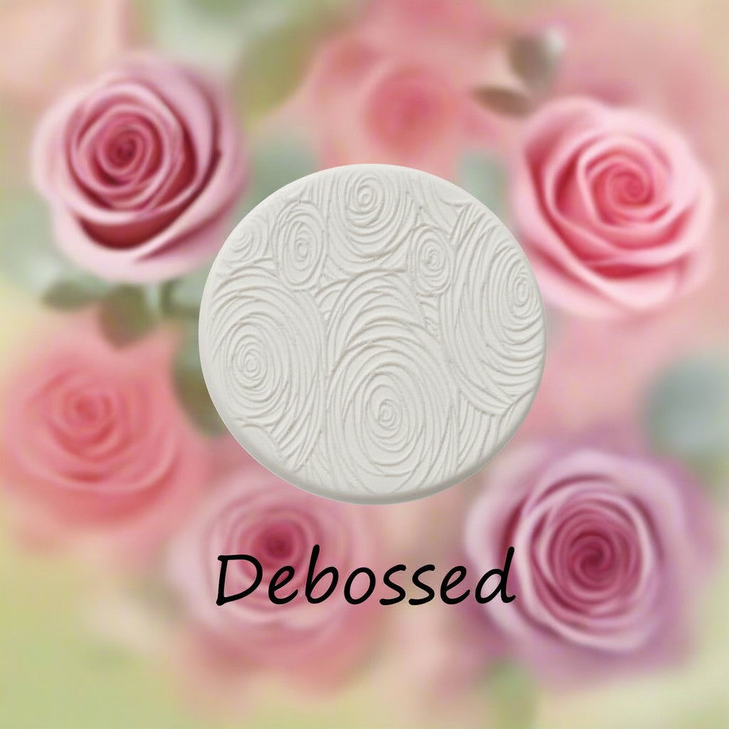 A rose pattern embossed in clay Using a rose patterned debossed texture mat. 