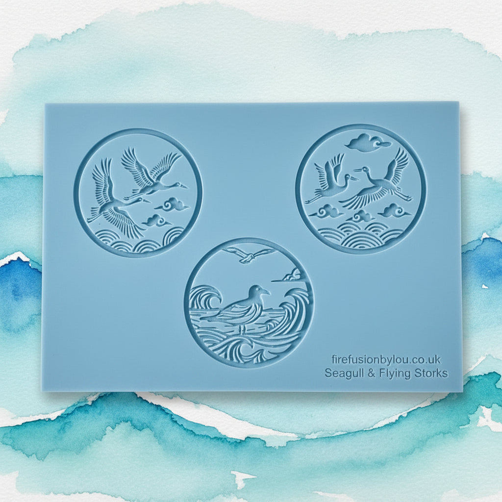 A rectangular grey texture mat with three circular debossed designs featuring seagulls and flying birds over stylized waves. Small printed text in the lower right reads 'firefusionbylou.co.uk