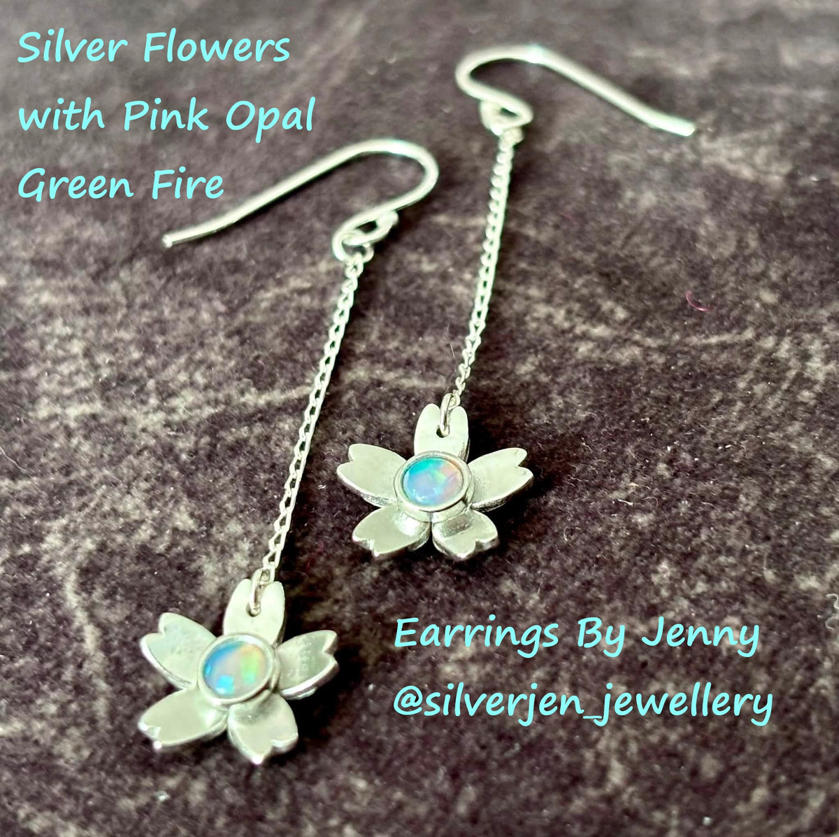 Silver flower drop earrings with pink opal centers, displayed on a dark textured surface with text overlays reading 'Silver Flowers with Pink Opal Green Fire' and 'Earrings By Jenny @silverjen_jewellery'.