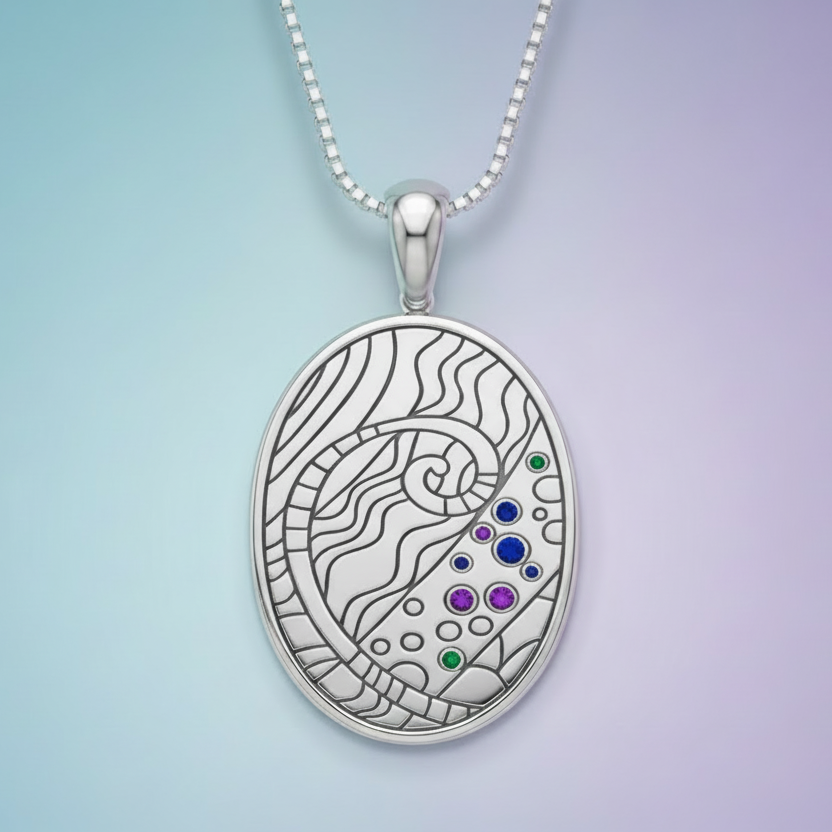 Silver pendant with intricate design and cubic zirconia. 