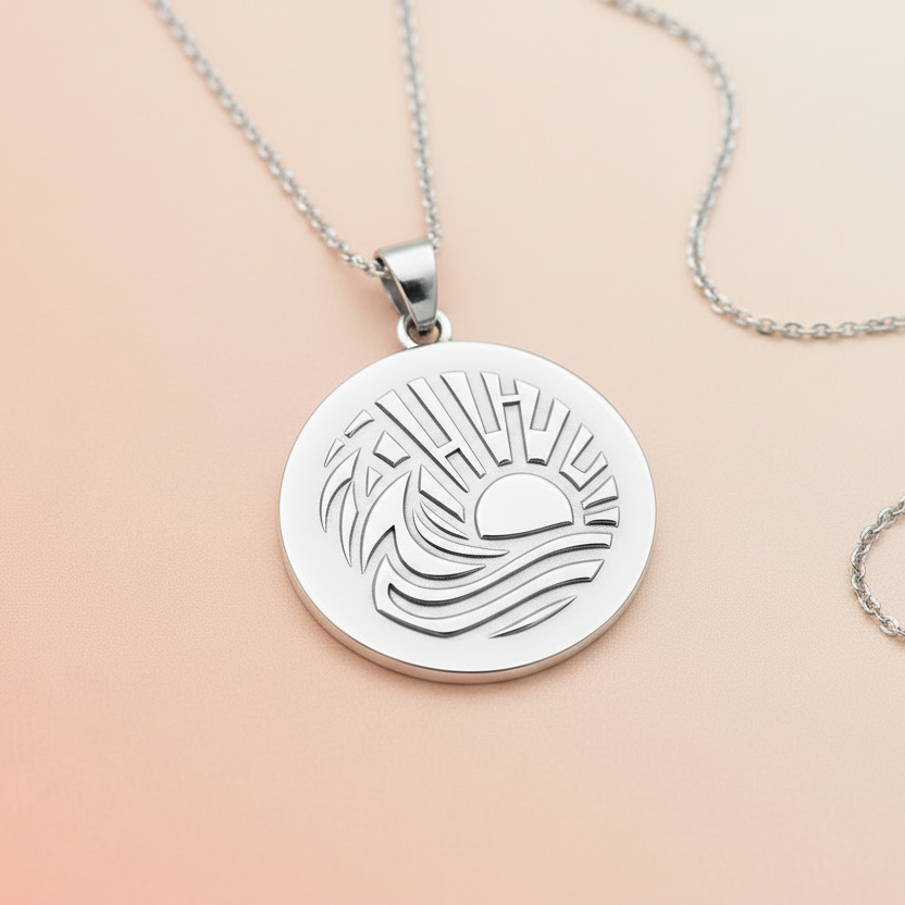"Silver necklace made with sun and waves texture design from debossed mat"