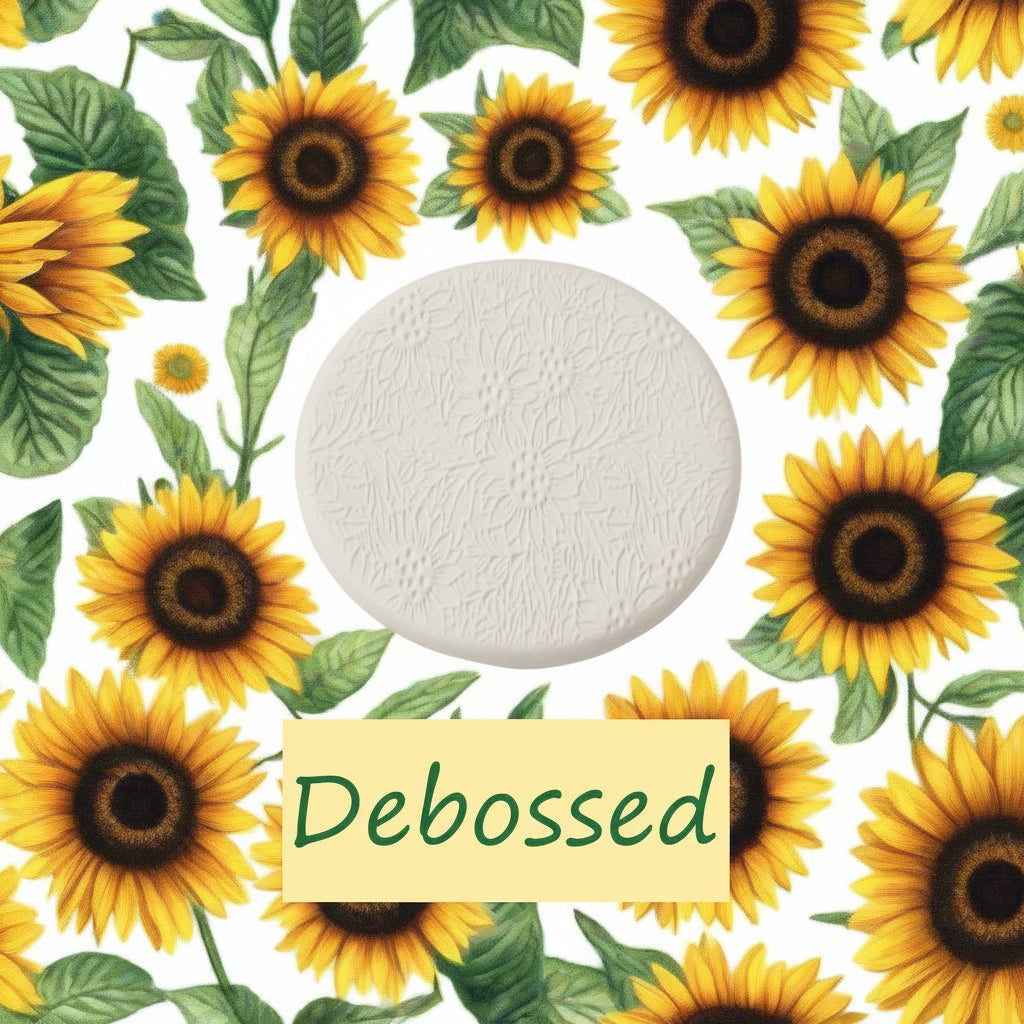A small sunflower pattern embossed in clay using a small sunflower patterned debossed texture mat.