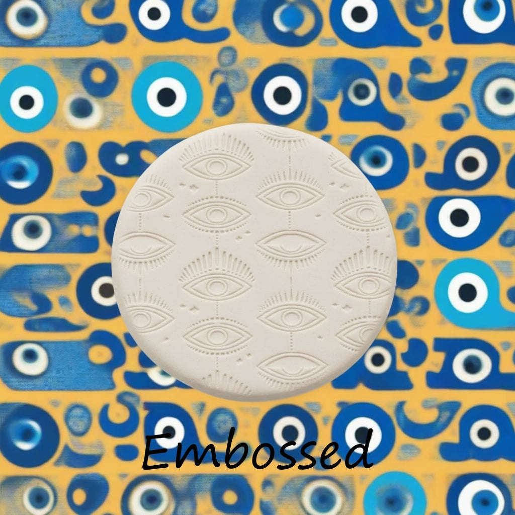 A mystical eye pattern debossed in clay sing a patterned embossed texture mat. This will give you an idea of what it will look like on metal clay or polymer clay.