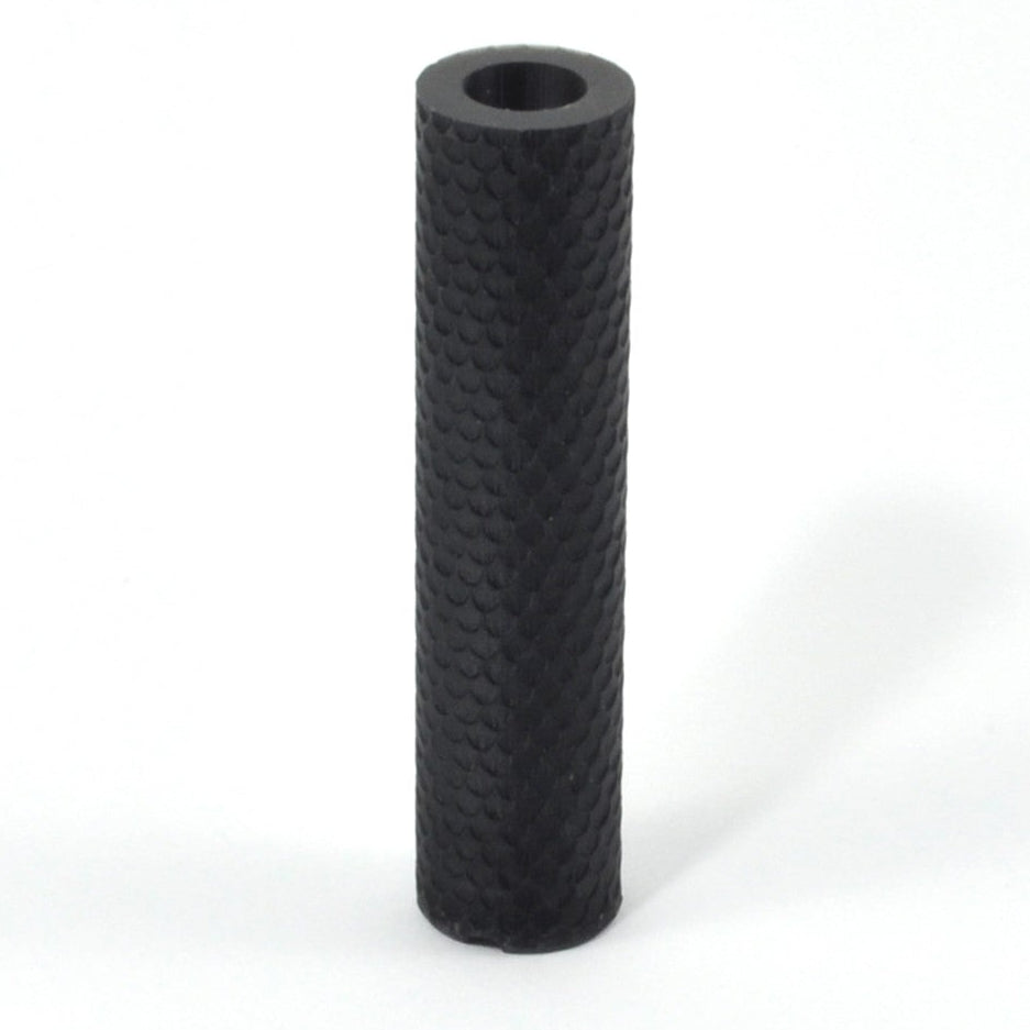 Black textured cylindrical object on a white background