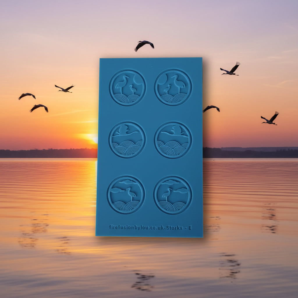 Blue texture with bird designs against a sunset over water background