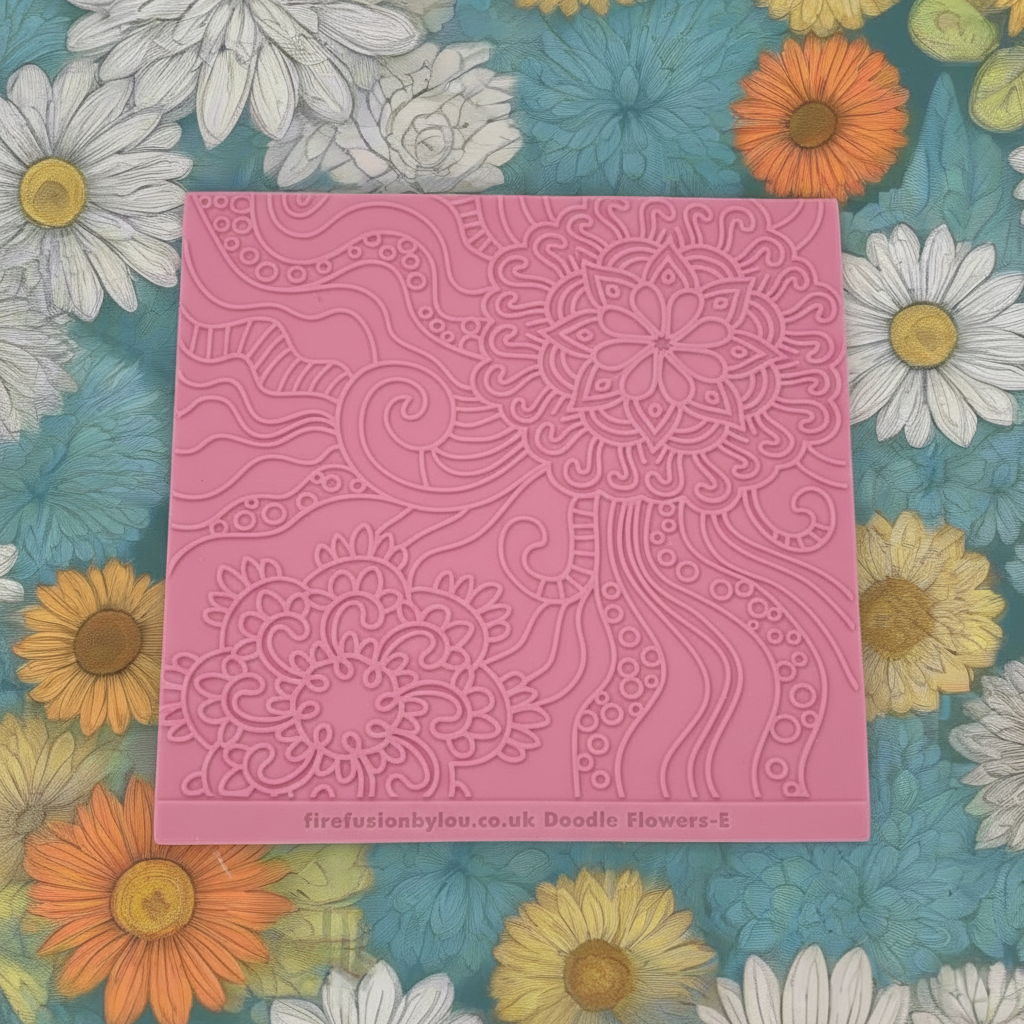 A pattern embossed texture mat. This texture mat will give you a debossed effect on metal clay or polymer clay.