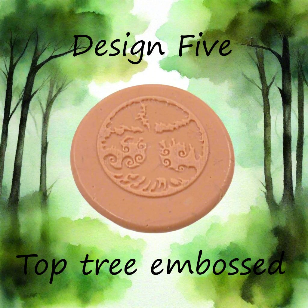 A tree debossed in silly putty Using a  embossed texture mat. This will give you an idea of what it will look like on metal clay or polymer clay