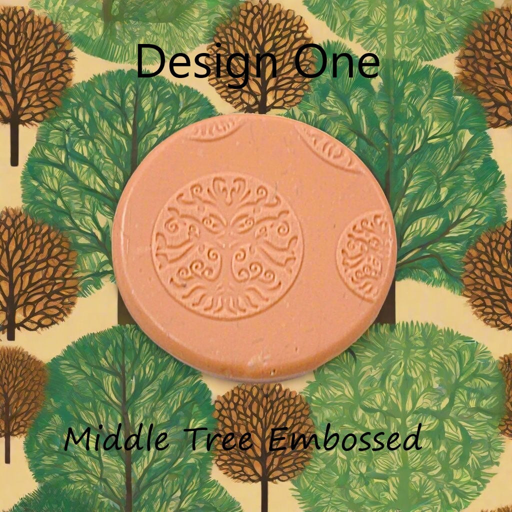 A tree debossed in silly putty Using a  embossed texture mat. This will give you an idea of what it will look like on metal clay or polymer clay