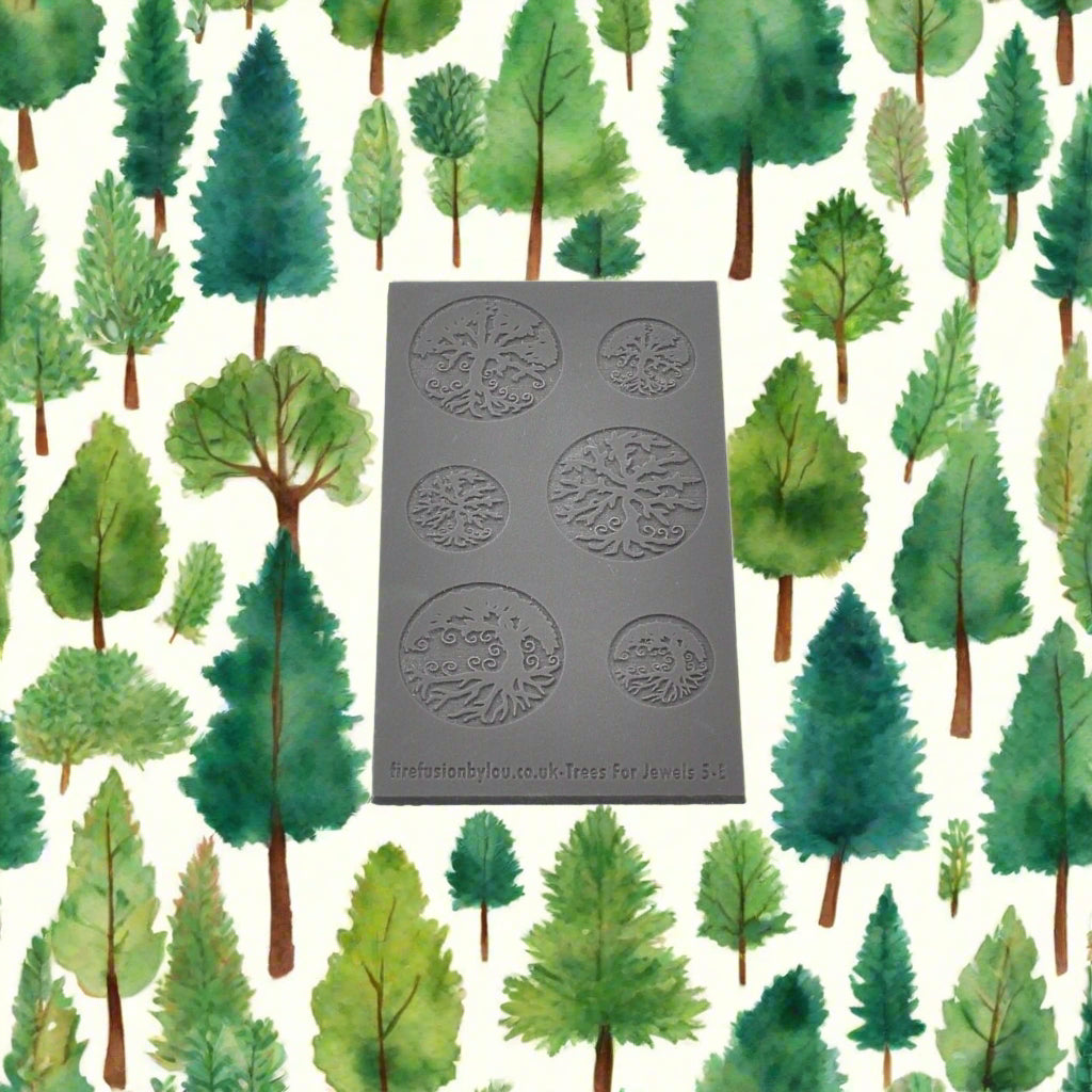 An embossed tree texture mat with tree designs and two sizes. use to make an impression on metal clay and polymer clay.