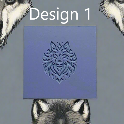 A square blue rubber showing a carved wolf head design, with the text 'Design 1' above it and wolf illustrations partially visible around the edges on a grey background.