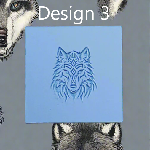 A square blue rubber showing a carved wolf head design, with the text 'Design 3' above it and wolf illustrations partially visible around the edges on a grey background.