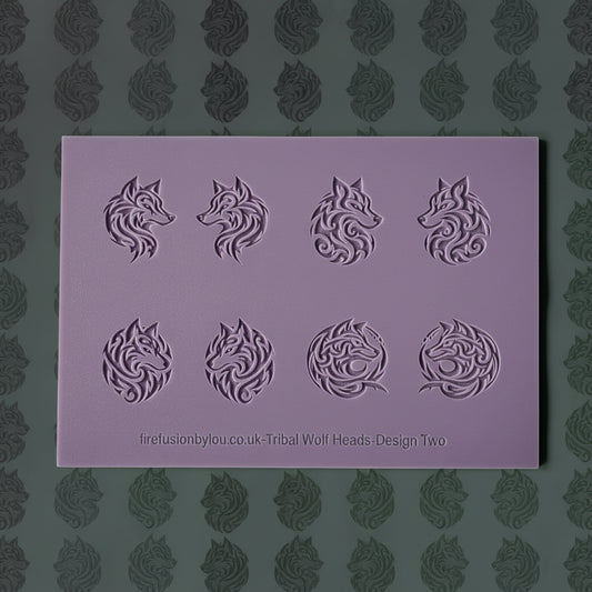 A lilac rectangular texture mat featuring eight embossed wolf head designs in various circular and profile arrangements, with the text 'firefusionbyyou.co.uk