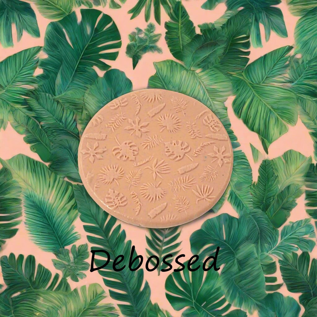 tropical leaves embossed in silly putty Using a  debossed texture mat. This will give you an idea of what it will look like on metal clay or polymer clay.