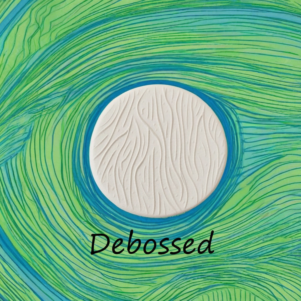 A pattern embossed in clay using a patterned debossed texture mat.