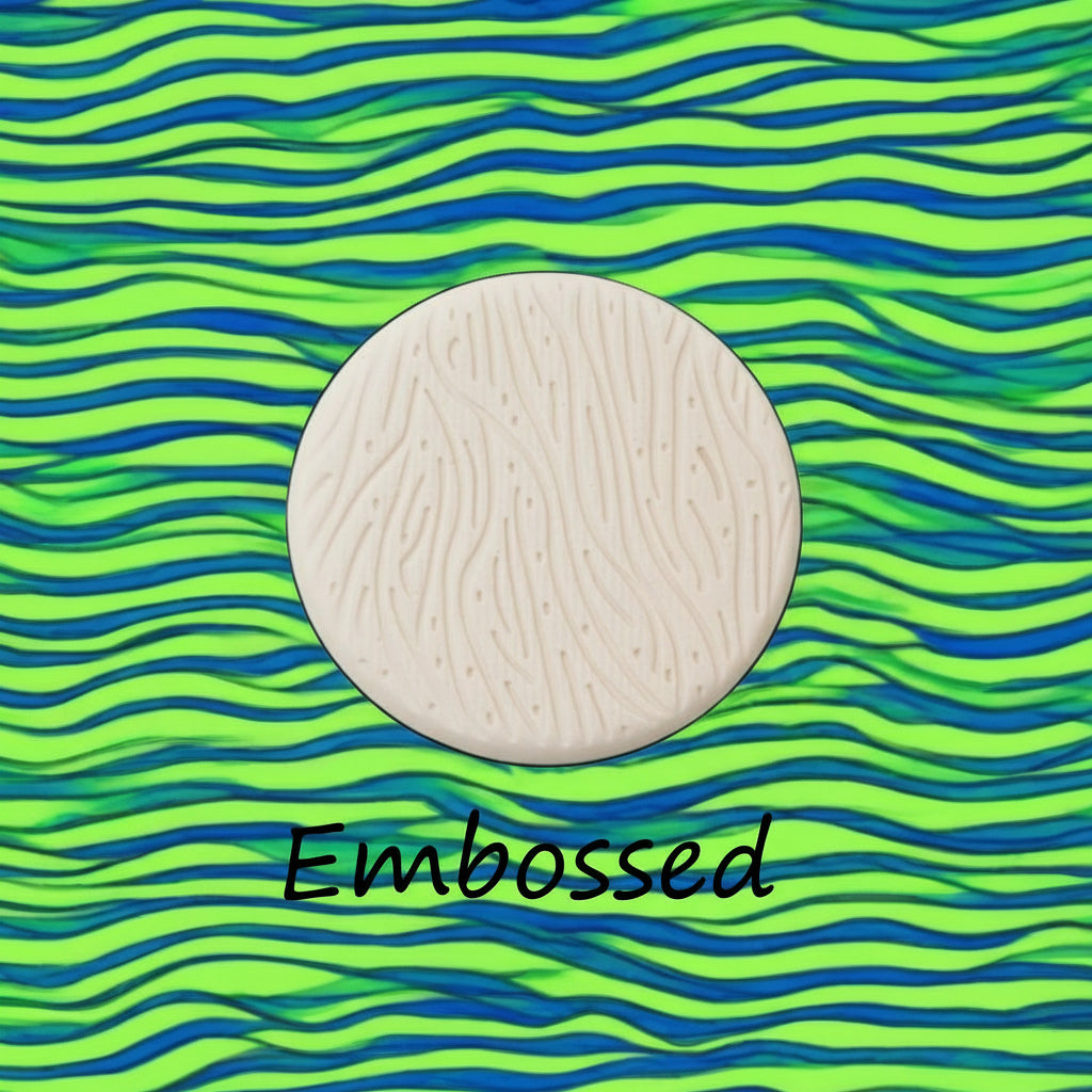 A pattern debossed in clay using a patterned embossed texture mat.