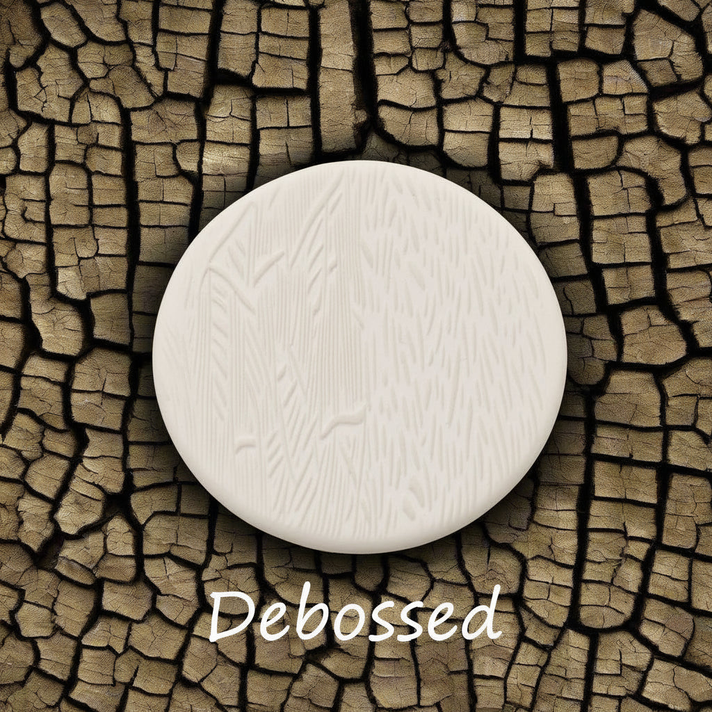 Tree bark designs embossed in clay Using a  debossed texture mat. This will give you an idea of what it will look like on metal clay or polymer clay.