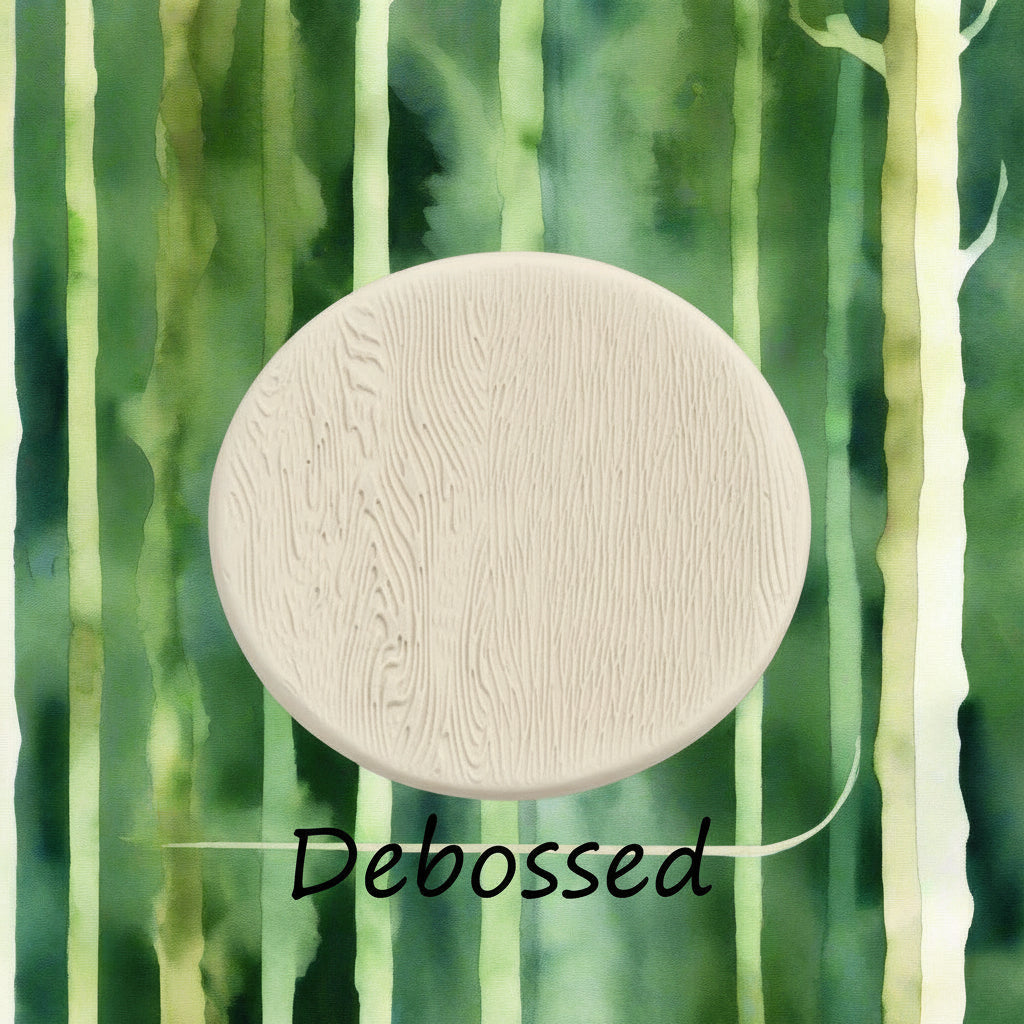 Tree bark designs embossed in clay Using a  debossed texture mat. This will give you an idea of what it will look like on metal clay or polymer clay.