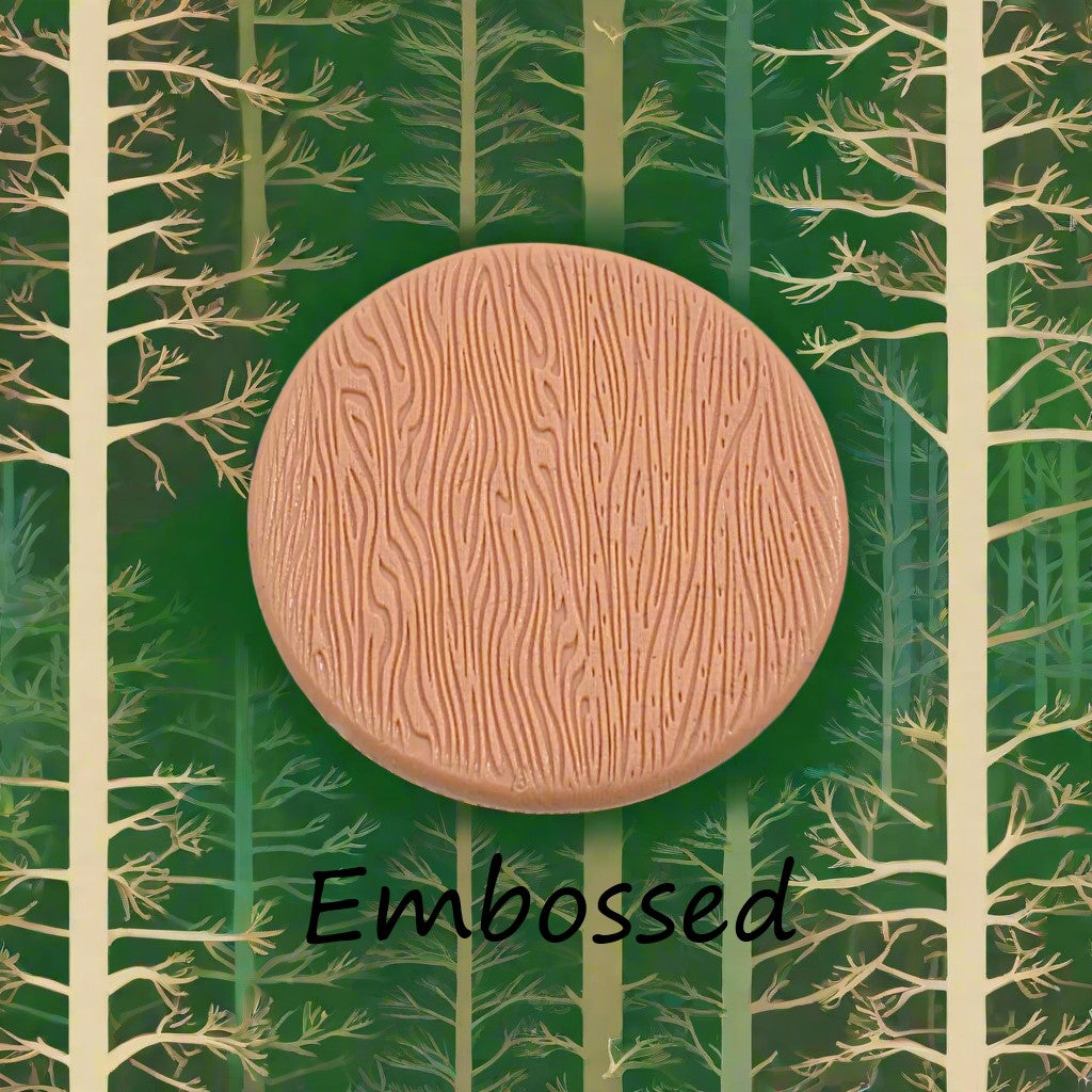 Tree bark designs debossed in silly putty Using a embossed texture mat. This will give you an idea of what it will look like on metal clay or polymer clay.