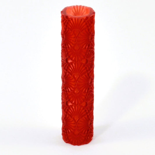 Red textured cylindrical roller on a white background