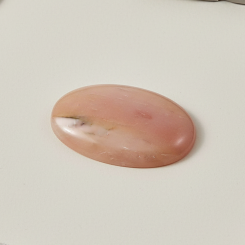 Pink stone on a light gray background