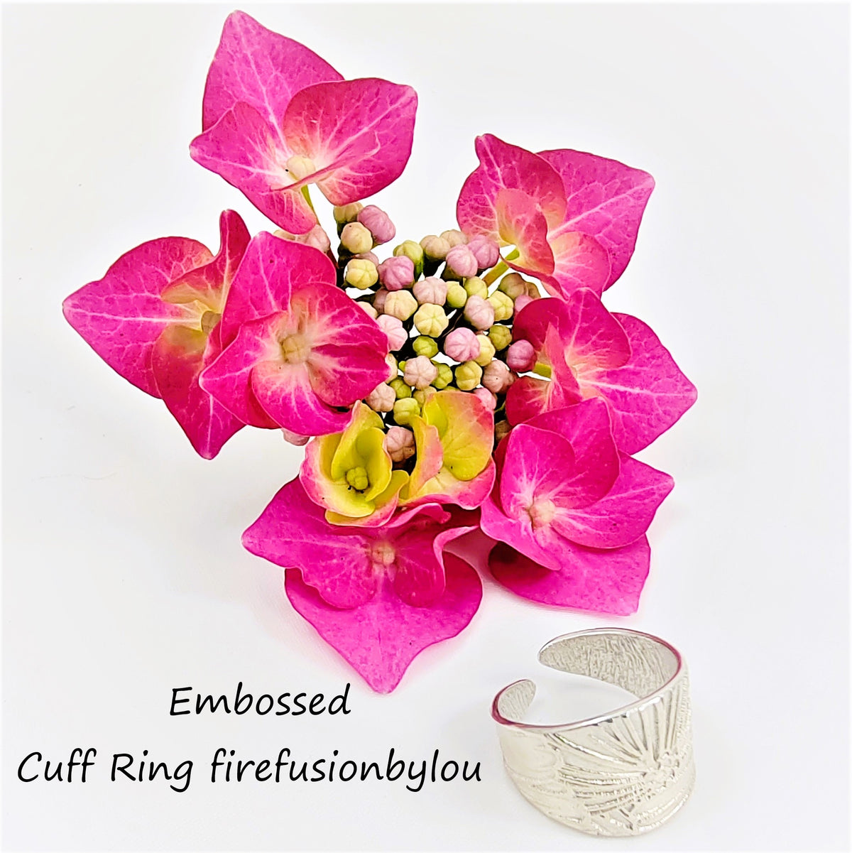 bursting berry silver ring cuff made using a texture may with flowers on metal clay.